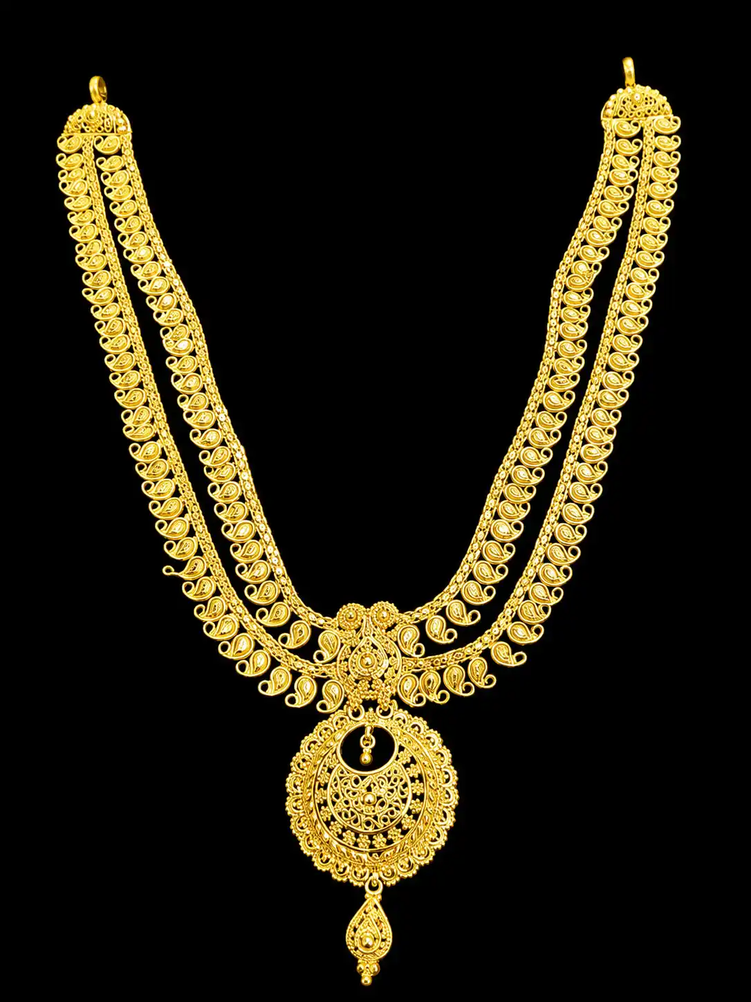 Ornate Gold Filigree Necklace Against