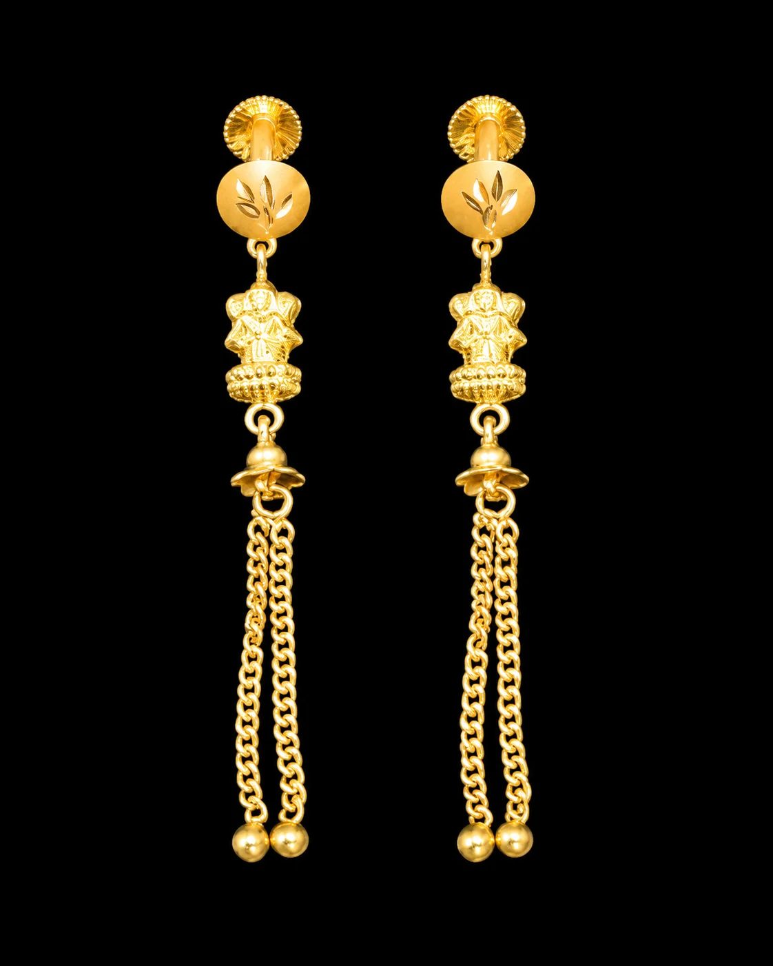 Gold swirl earrings on pure