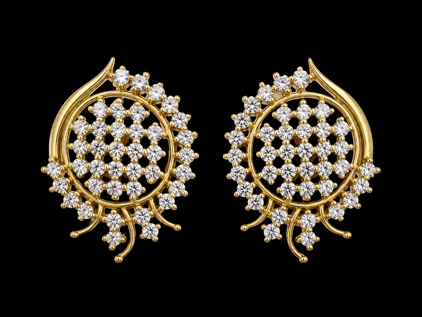Paired gold earrings