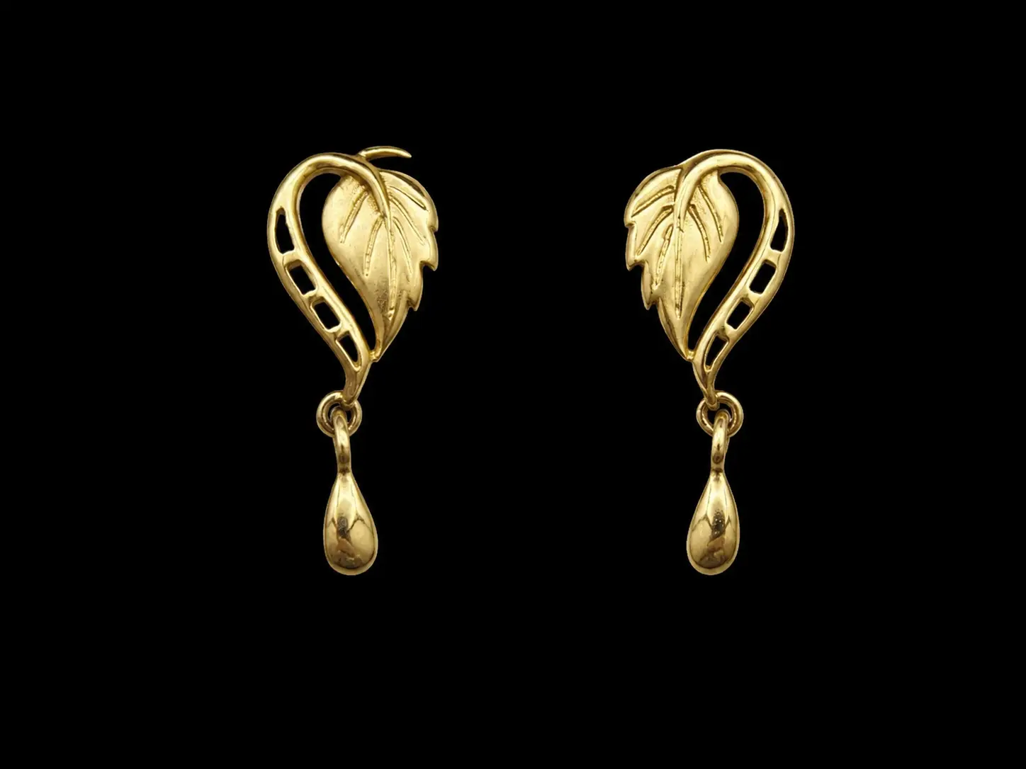 Paired gold leaf earrings